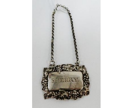 Early 19th century silver 'Sherry' decanter label with makers mark for J. Wilmore, with fruit and vine border, circa 1825 