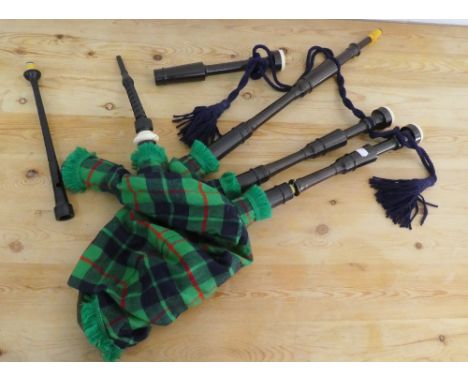 Highland Bagpipes by Piob Mhor, Blairgowrie, African blackwood drones with imitation ivory ring caps, poly stocks, blow pipe 