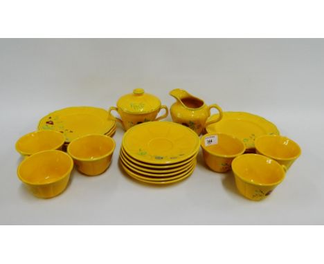 French yellow glazed teaset comprising six cups, six saucers, six side plates, sugar bowl and cream jug, (a lot) 