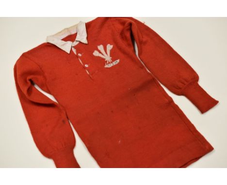 1912 WELSH INTERNATIONAL RUGBY JERSEY MATCH-WORN BY B R LEWIS Condition: woollen jersey complete with white collar and Prince