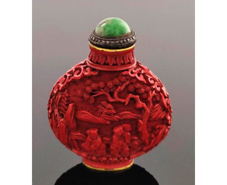 A Chinese cinnabar lacquer snuff bottle, of shouldered form, carved in relief with figures and pagodas in a wooded mountainou