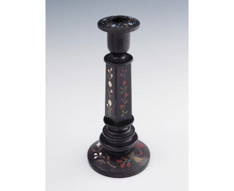 A large Ashford marble candlestick, circular turned black marble base inlaid with petra dura hardstone specimens of flowers, 