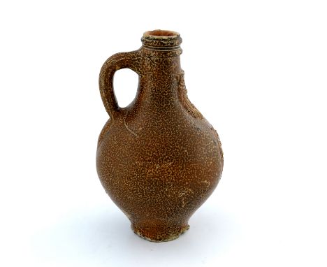 A Bartmann Bellarmine jug, salt glazed stoneware, probably 17th century, circa 1680, relief moulded with coat of arms below  