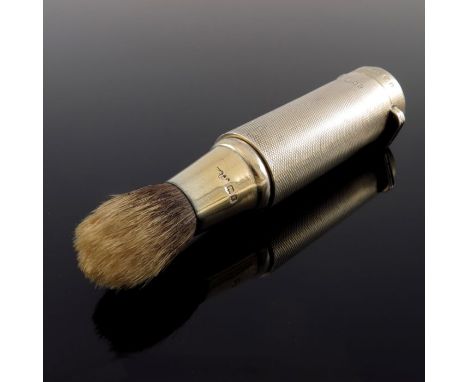 A George V silver gilt travelling shaving brush, Finnigans Ltd., London 1919, engine turned tubular form with hinged lid and 