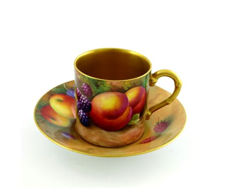 G Moseley and A Shuck for Royal Worcester, a fruit painted coffee can and saucer, circa 1938, decorated with peaches, blackbe