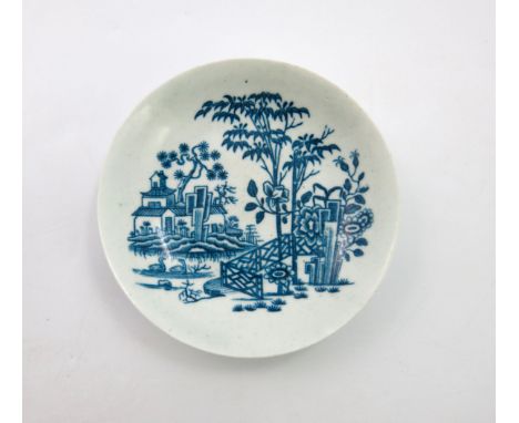 A Worcester blue and white saucer, circa 1760, Plantation pattern, 12cm diameter