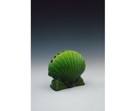 Christopher Dresser for Ault, an art pottery flower vase, circa 1885, relief moulded as a shell with nine individual stem hol