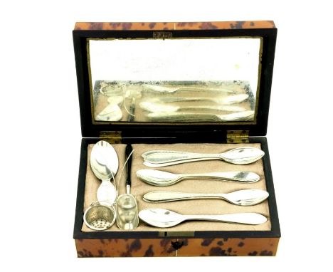 An early 19th century tortoiseshell cased Dutch silver tea accoutrement set, 1816 to 1830, including twelve bright cut teaspo