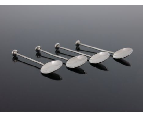 Bernard Instone, a set of four Arts and Crafts silver and enamelled coffee spoons, Birmingham 1928, circular concave bowls on