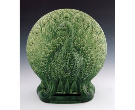 Christopher Dresser for Ault, a large art pottery majolica glazed peacock vase, circa 1880, relief moulded to each side, with