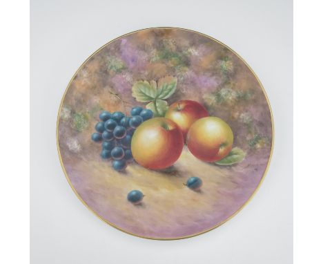 A Royal Worcester  fruit painted plate, circa 1960, circular form, decorated with apples and grapes on a moss covered ground,