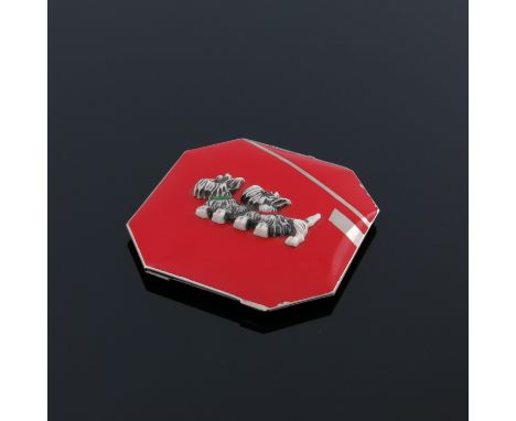 A Czechoslovakian Art Deco enamelled and celluloid compact, octagonal form, applied with two Scottie dogs in relief, red enam