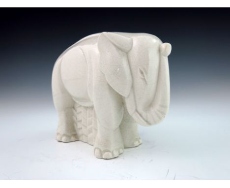 Charles Lemenceau, an Art Deco ceramic figure of an elephant, circa 1930, modelled standing, with trunk raised, 23cm long    