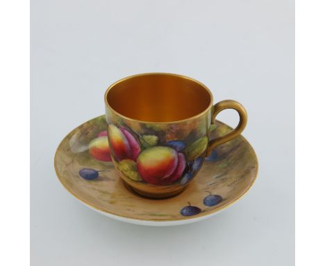 Walter Austin for Royal Worcester, a fruit painted coffee cup and saucer, circa 1922, decorated with peaches and damsons on m