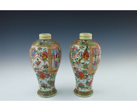 A pair of 19th Century Cantonese enamel Meiping vases, famille rose decoration of panels of figures at leisure, gilt detailin