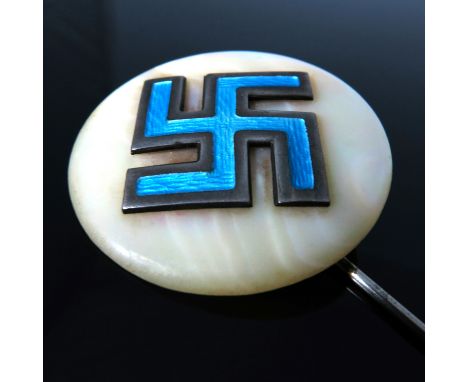 A Swastika pin badge, enamel swastika mounted on mother of pearl and silver pin, Arthur Johnson Smith, Chester 1911, accompan