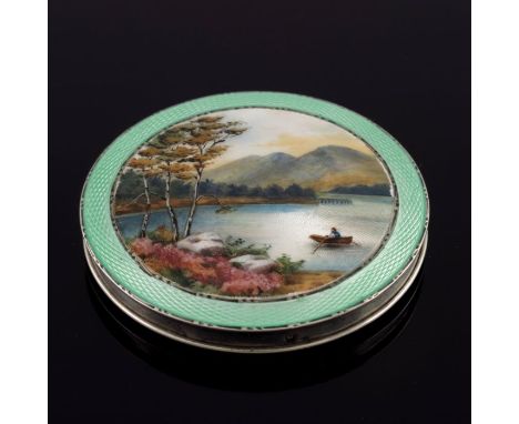 A George V silver and enamelled compact, Henry Clifford Davis, Birmingham 1936, circular, the lid painted with a mountain lak
