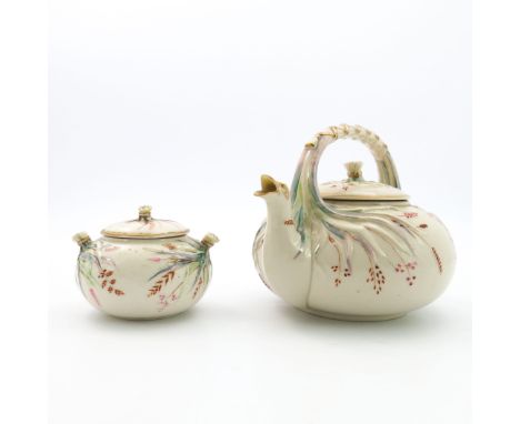 A Belleek first period Grass kettle and covered sugar bowl, relief moulded and highlighted in gilt and coloured lustre, back 