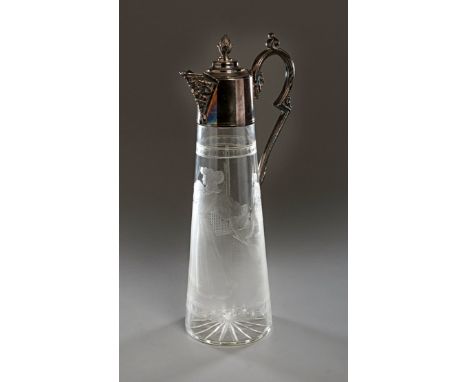 An unusual Victorian glass wine decanter engraved to the body with a lawn tennis scene,
portraying an elegant Victorian lady 