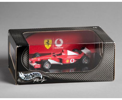 Michael Schumacher exclusive 2002 Ferrari Formula 1 Hot Wheels models,
a sample package and unopened carton containing a furt