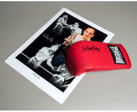 A Sir Henry Cooper signed boxing glove,
a red left-hand Lonsdale signed in black marker pen; sold with a Cooper-signed "Briti