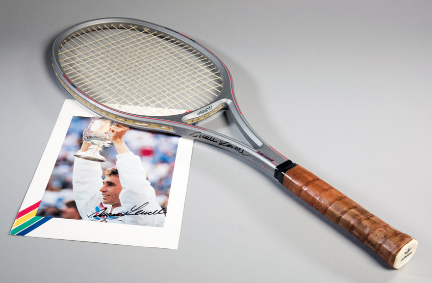 An Ivan Lendl signed tennis racquet and photograph, an Adidas CF 25-F