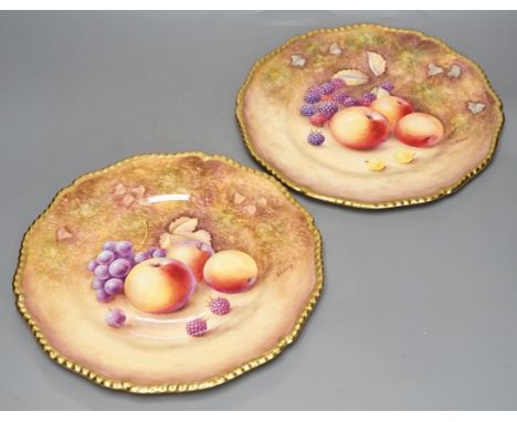 A pair of Royal Worcester fruit painted dinner plates, post war, by J. Reed, 27cm diameter