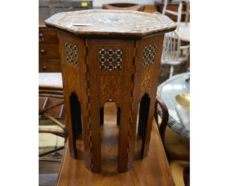 A Moorish octagonal mother of pearl inlaid centre table, width 46cm, height 62cm