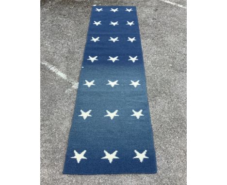 A contemporary wool runner with star motifs, 300 x 76cm