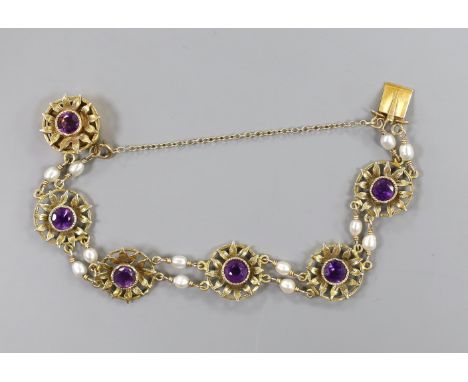A 14ct, amethyst and baroque pearl set flower head bracelet, 16cm, gross weight 14.8 grams.