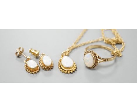 A modern suite of 9ct gold and white opal jewellery, comprising a ring, pendant on chain and pair of earrings, gross weight 9