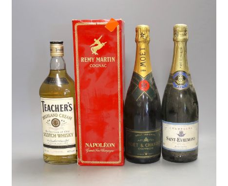 One bottle of 1986 Moët and Chandon Brut champagne, together with a bottle of Saint-Evremond champagne, a 70cl bottle of Teac