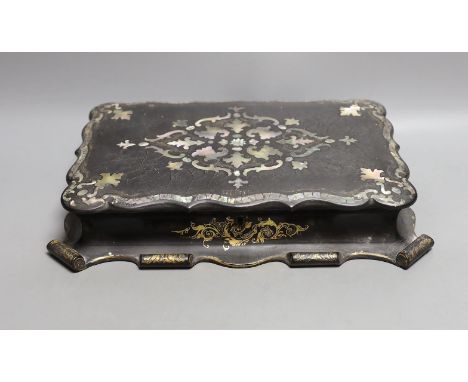 A Victorian papier-mâché games box with mother of pearl inlay and mother-of-pearl counters