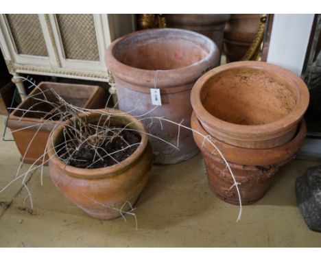 Four circular terracotta garden planters, together with a square planter, largest diameter 48cm, height 48cm