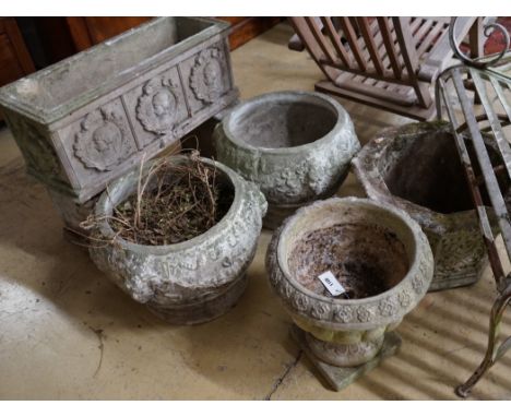 A rectangular reconstituted stone garden planter on twin block supports, width 70cm, a hexagonal garden planter and three cir