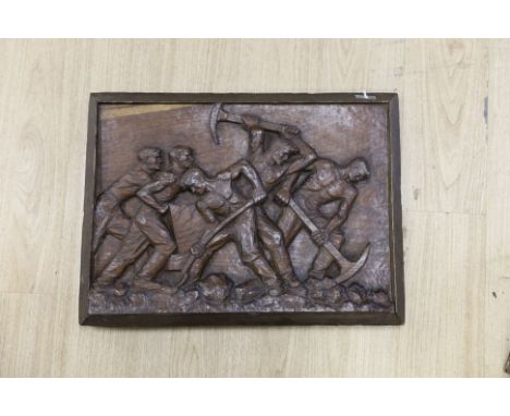 K Franke, a 1930’s carved oak panel of men digging possibly in a mine,66 cms wide x 49 cms high.