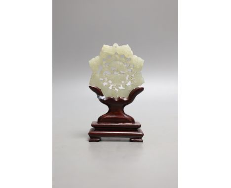 A Chinese pale celadon jade star shaped plaque, wood stand, 12cm
