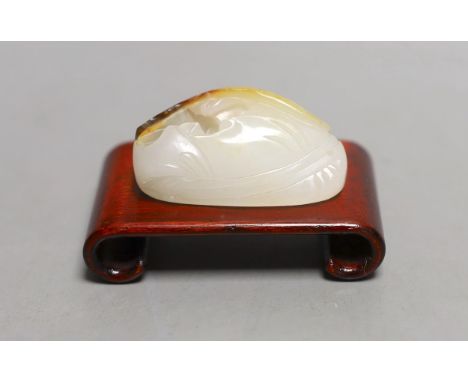 A Chinese white and russet jade pendant, 4.5cm