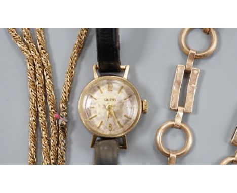A 9ct bracelet, a 9kt necklace, 11.5 grams, and a lady's 9ct gold Smiths, manual wind wrist watch, on a leather strap, gross 