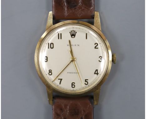 A gentleman's late 1960's 9ct gold Rolex precision manual wind wrist watch, with case back inscription, on associated leather