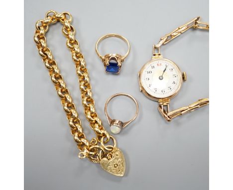 A modern 9ct gold bracelet, 18cm, 11.9 grams, two 9ct rings an a lady's 9ct gold manual wind wrist watch, on a 9ct bracelet, 