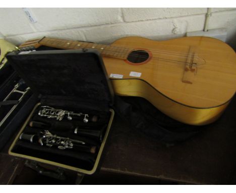 ACOUSTIC GUITAR AND CASE TOGETHER WITH A FOUR-PIECE CLARINET (2) 