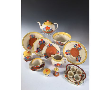 A Clarice Cliff Crocus pattern tea service, comprising teapot and cover, milk jug, preserve pot and cover, slop bowl, six tea