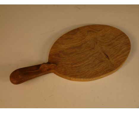 A Robert 'Mouseman' Thompson oak cheese board, the oval paddle with handle and carved mouse signature 38 x 18cm (15 x 7in)  