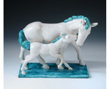A Goldscheider model of a mare and foal, in white and turquoise crackle glaze, painted and impressed marks 21cm (8in)  