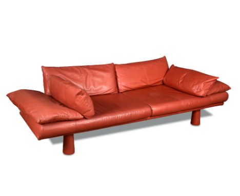 A 20th century red leather Finnish design sofa, with loose cushions raised four tapering cylindrical legs 75 x 230 x 90cm (29