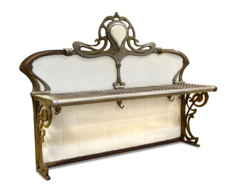 A French Art Nouveau steel and enamel bakery shelf, the scrolling back above a pierced shelf with hooks below to scroll work 