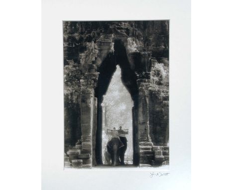 John McDermott, (American, 20th century), two photographic prints, 'Elephants at the Gate, Angkor Thom' and 'Monk in the Wind