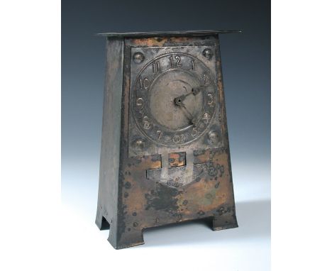 Attributed to the Guild of Handicraft, a copper and electroplate mantle clock, circa 1895, the tapering copper case with appl