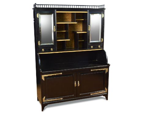 An Aesthetic period ebonised cabinet, the galleried top above a central asymmetric shelf arrangement flanked by mirrored cupb